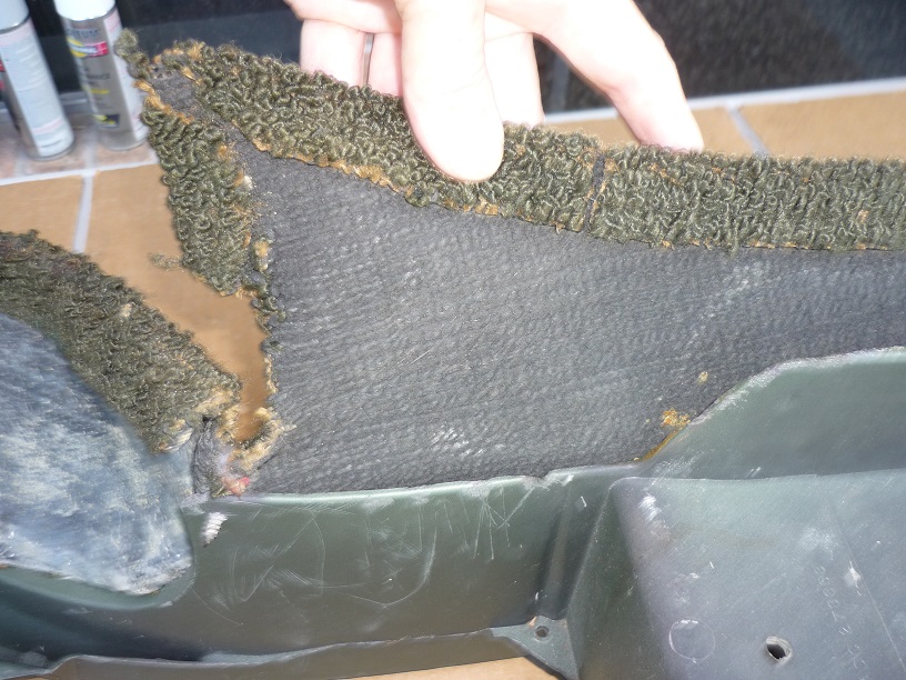 Attached picture 21-17 Console.carpet16.L rear.what looks like torn edge left center is apparently original.jpg